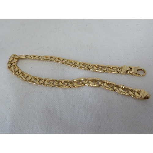 46 - A hallmarked 14ct yellow gold fancy flat link bracelet, 20.5cm long, 14.4 grms