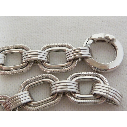 49 - A hallmarked 9ct white gold flat link bracelet, 20 cm long, 14.5 grms