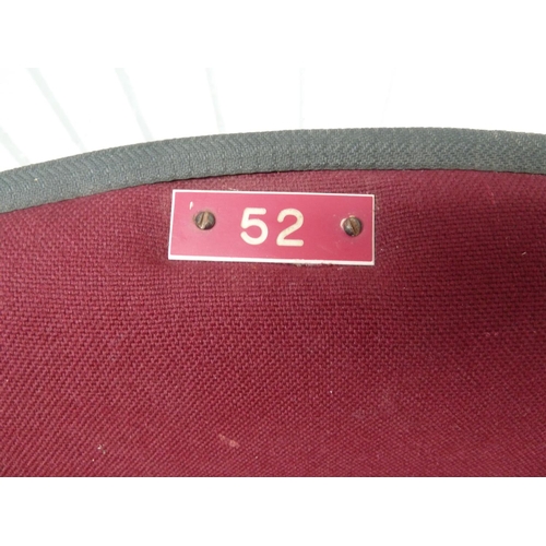 172 - A Royal Albert Hall stall chair, modern bucket seat shape on swivel stands, upholstered in cherry re... 