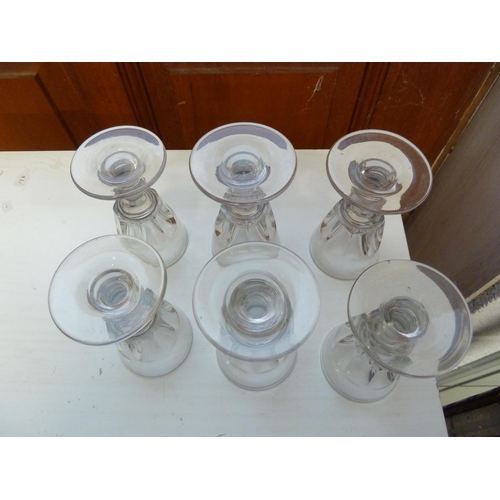 175 - A set of six Victorian toasting glasses, the panelled bowls with deceptive interior on bladed knop s... 