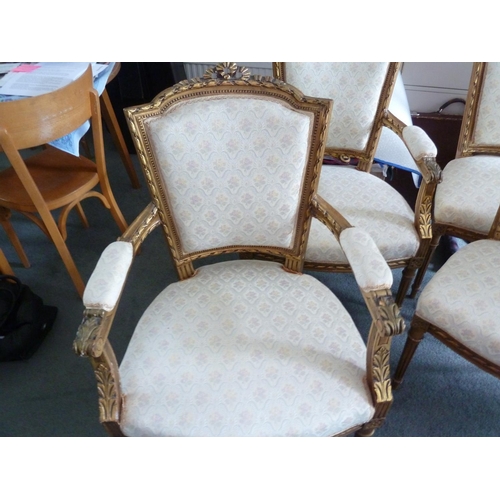 176 - A Louis XVI style salon set of six side chairs and two chairs with arms, gilded gesso frames surmoun... 