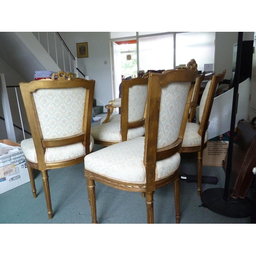 176 - A Louis XVI style salon set of six side chairs and two chairs with arms, gilded gesso frames surmoun... 