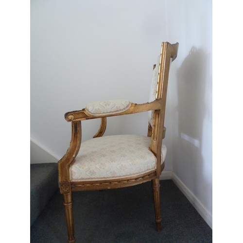 176 - A Louis XVI style salon set of six side chairs and two chairs with arms, gilded gesso frames surmoun... 