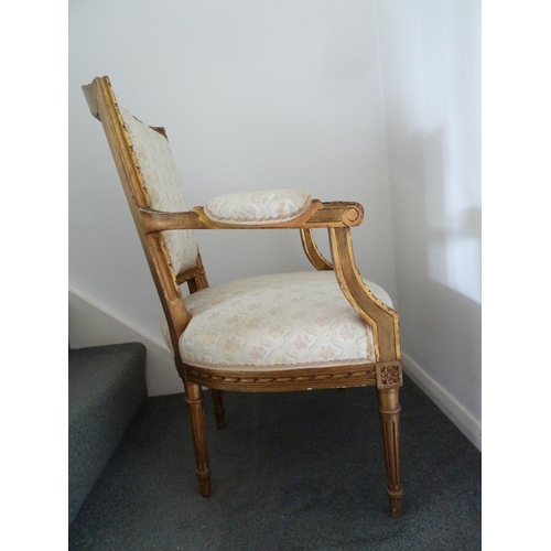 176 - A Louis XVI style salon set of six side chairs and two chairs with arms, gilded gesso frames surmoun... 