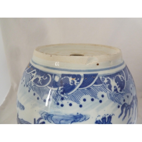 177 - A Chinese fish bowl jardiniere, decorated in blue with a coiled five claw dragon chasing a flaming p... 