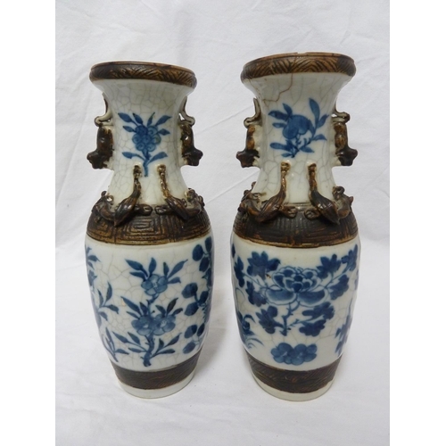 178 - A pair of Chinese porcelain crackle-ware vases, of baluster form decorated in blue and white with bi... 