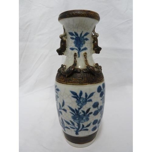 178 - A pair of Chinese porcelain crackle-ware vases, of baluster form decorated in blue and white with bi... 