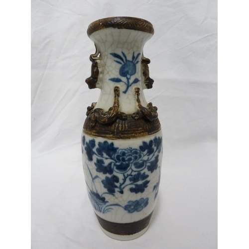 178 - A pair of Chinese porcelain crackle-ware vases, of baluster form decorated in blue and white with bi... 