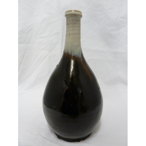 180 - A Japanese Chosen Karatsu sake bottle /vase, of smoke grey graduating to dark chocolate brown glaze,... 