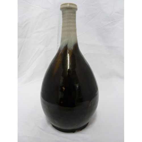 180 - A Japanese Chosen Karatsu sake bottle /vase, of smoke grey graduating to dark chocolate brown glaze,... 