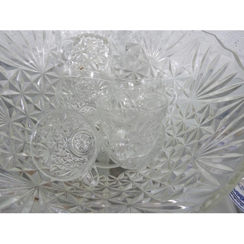 184 - A colourless glass punch bowl and glasses, comprising large bowl; and twelve glasses (13)