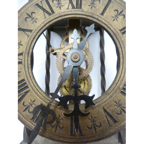 104 - A reproduction brass skeleton wall clock, weight and chain (3)