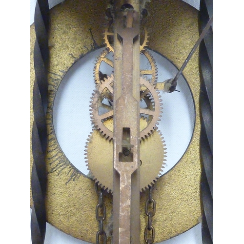 104 - A reproduction brass skeleton wall clock, weight and chain (3)