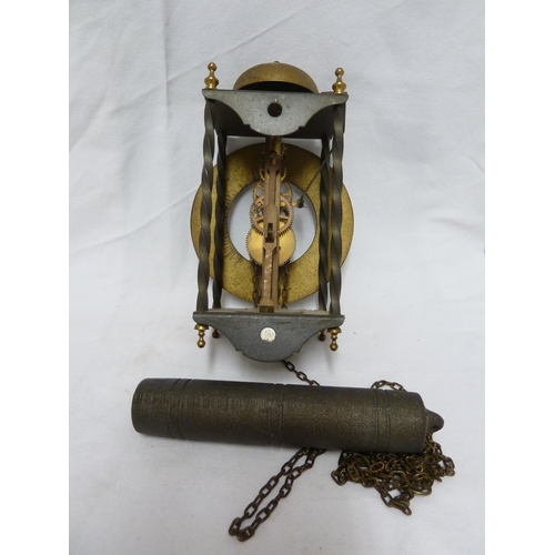 104 - A reproduction brass skeleton wall clock, weight and chain (3)