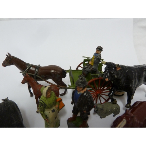 138 - A Britain's lead farmers cart and driver; other lead farmyard figures; and a 'porky pig' type lead f... 