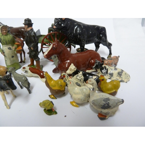 138 - A Britain's lead farmers cart and driver; other lead farmyard figures; and a 'porky pig' type lead f... 