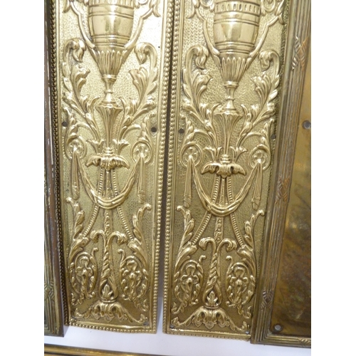 142 - Door Furniture - a pair of pressed brass finger plates decorated with neoclassical urns; a pair of f... 