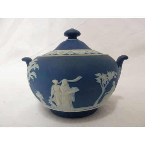 187 - A three piece Wedgwood Portland blue jasper tea set, sprigged in white with classical figures in a g... 