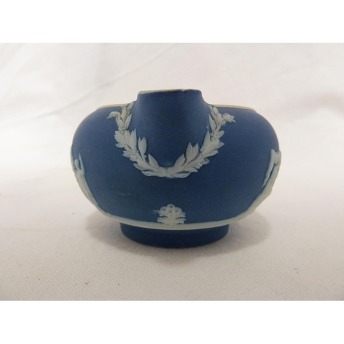 187 - A three piece Wedgwood Portland blue jasper tea set, sprigged in white with classical figures in a g... 