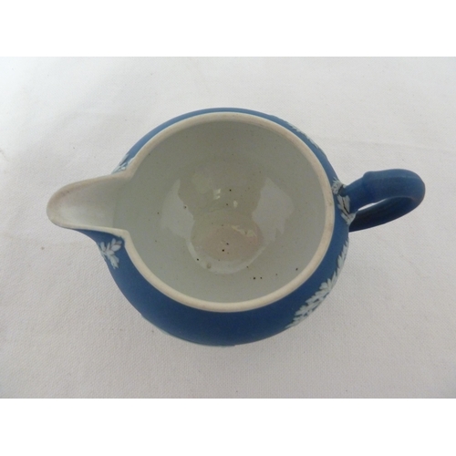 187 - A three piece Wedgwood Portland blue jasper tea set, sprigged in white with classical figures in a g... 