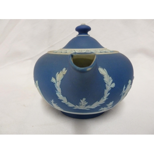 187 - A three piece Wedgwood Portland blue jasper tea set, sprigged in white with classical figures in a g... 