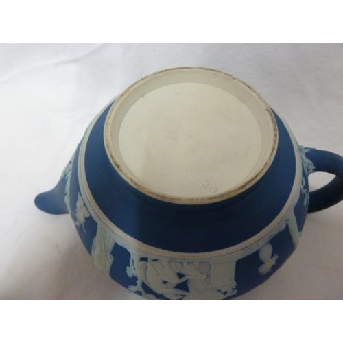 187 - A three piece Wedgwood Portland blue jasper tea set, sprigged in white with classical figures in a g... 