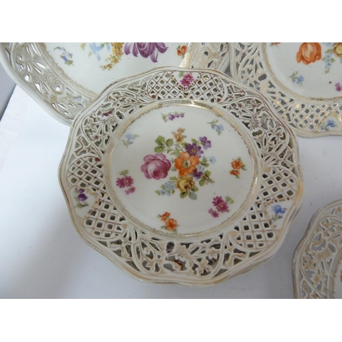 204 - A Schumann, Baveria porcelain dessert service, decorated with Summer flowers within pierced 'ribbon'... 