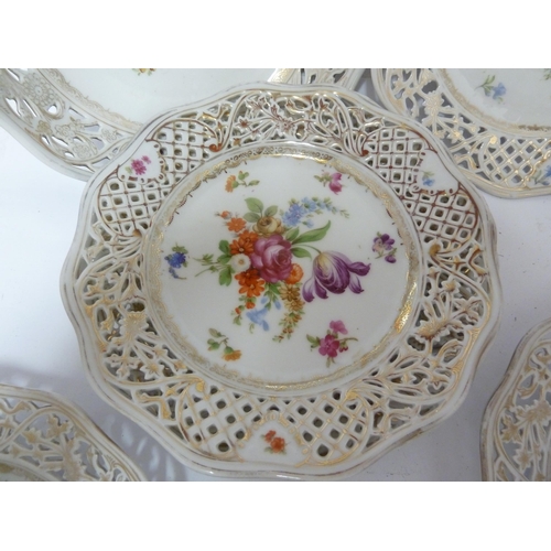 204 - A Schumann, Baveria porcelain dessert service, decorated with Summer flowers within pierced 'ribbon'... 