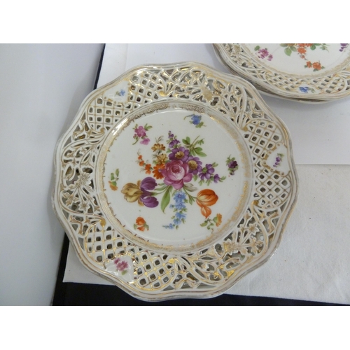 204 - A Schumann, Baveria porcelain dessert service, decorated with Summer flowers within pierced 'ribbon'... 