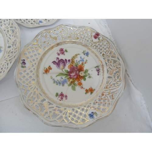 204 - A Schumann, Baveria porcelain dessert service, decorated with Summer flowers within pierced 'ribbon'... 