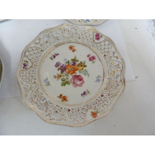 204 - A Schumann, Baveria porcelain dessert service, decorated with Summer flowers within pierced 'ribbon'... 