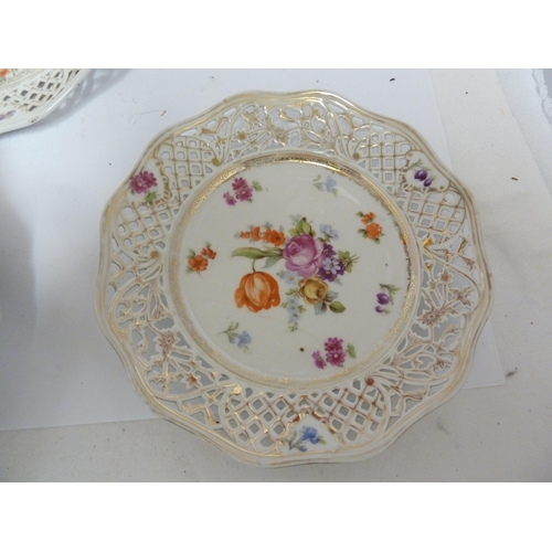 204 - A Schumann, Baveria porcelain dessert service, decorated with Summer flowers within pierced 'ribbon'... 