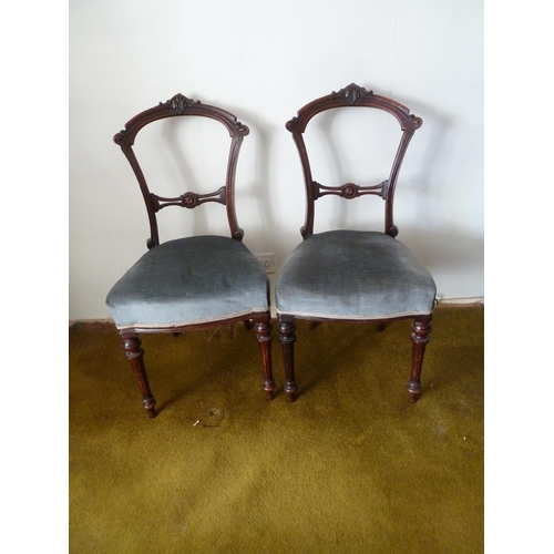 208 - A pair of Victorian mahogany bedroom chairs, bar back with foliate decoration to the top arch, taper... 