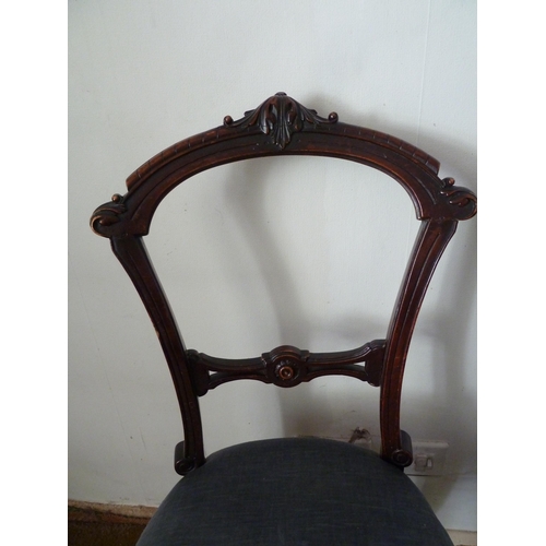 208 - A pair of Victorian mahogany bedroom chairs, bar back with foliate decoration to the top arch, taper... 