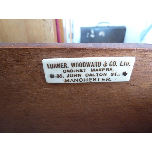 209 - Turner Woodward & Co Ltd, Manchester - a chest of drawers composed of three long drawers with oval r... 