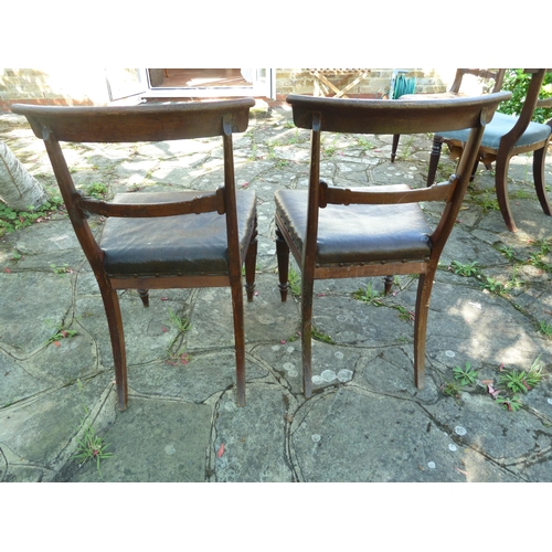 157 - A pair of Regency bar back side chairs, the bar bifurcated at each end forming a tight scroll, turne... 