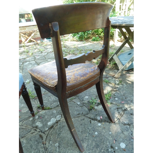 156 - A pair of Regency bar back side chairs bullseye motif to the center of the bar, reeded tapered legs ... 