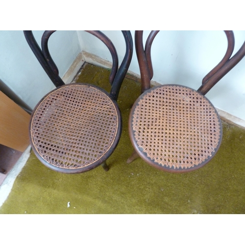 152 - Two child's bentwood chairs, cane seats,  53cm high