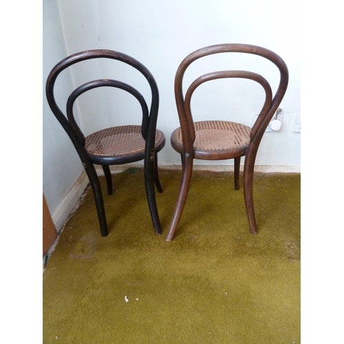 152 - Two child's bentwood chairs, cane seats,  53cm high