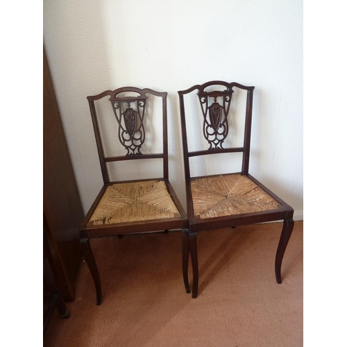 159 - A pair of Victorian mahogany splat back bedroom chairs carved with primrose type flowers, 88 cm h x ... 