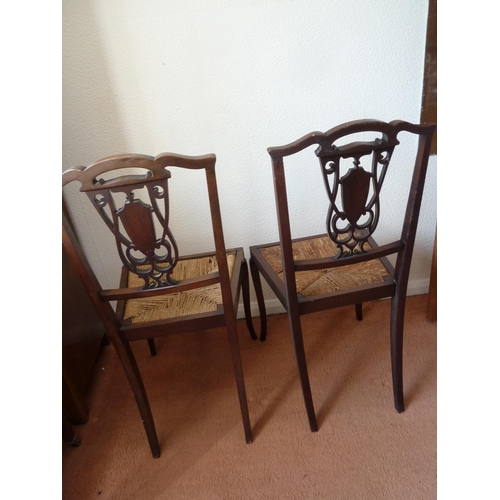 159 - A pair of Victorian mahogany splat back bedroom chairs carved with primrose type flowers, 88 cm h x ... 