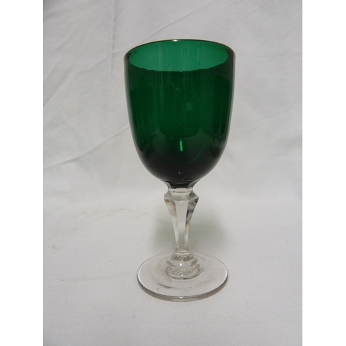 33 - Eight wine glasses, of emerald green bowls set on facetted colourless glass stems (8)