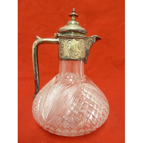 37 - A cut glass claret jug with silver plated mounts