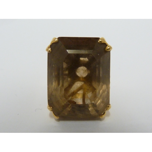 41 - A citrine ring, the setting of yellow metal marked 22ct, ring size I 1/2, 11.6 grms