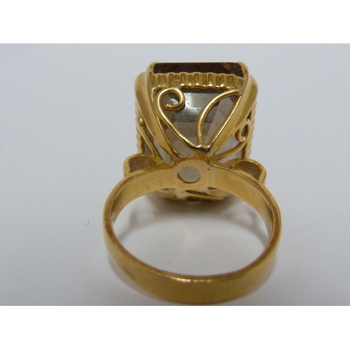 41 - A citrine ring, the setting of yellow metal marked 22ct, ring size I 1/2, 11.6 grms