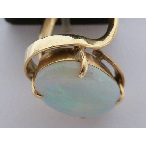 42 - An opal ring, set in yellow metal marked 585, ring size I 1/2, total weight 4.7 grms