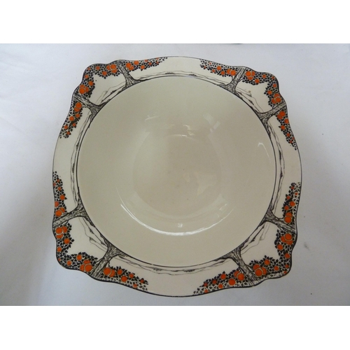 48 - A large Crown Ducal orange tree pattern meat plate; a round vegetable dish; and a shaped square vege... 