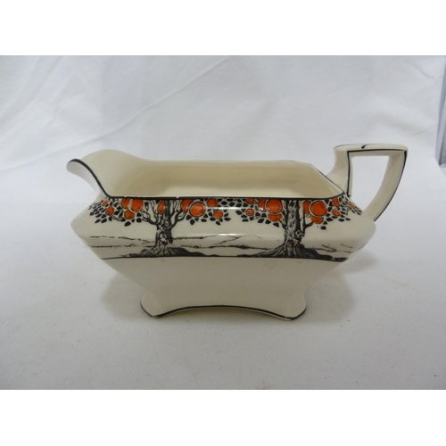 49 - A Crown Ducal Ware gravy boat; and three canted square vegetable tureens and covers 25.5cm max appro... 