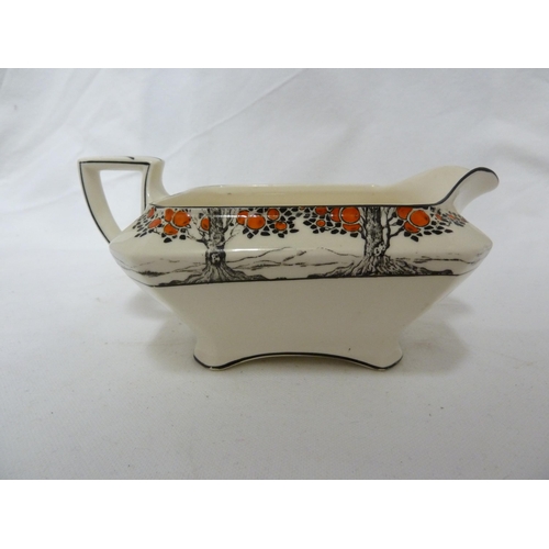 49 - A Crown Ducal Ware gravy boat; and three canted square vegetable tureens and covers 25.5cm max appro... 