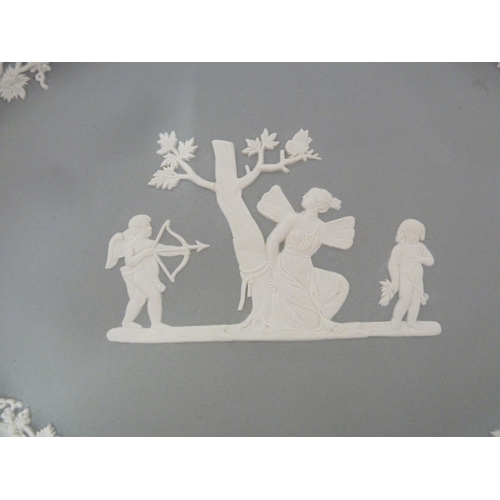 53 - A rare Wedgwood pigeon grey jasper oval plaque, sprigged with Diana and Cupid before a truncated tre... 